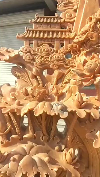 晚霞红鱼跃龙门石雕