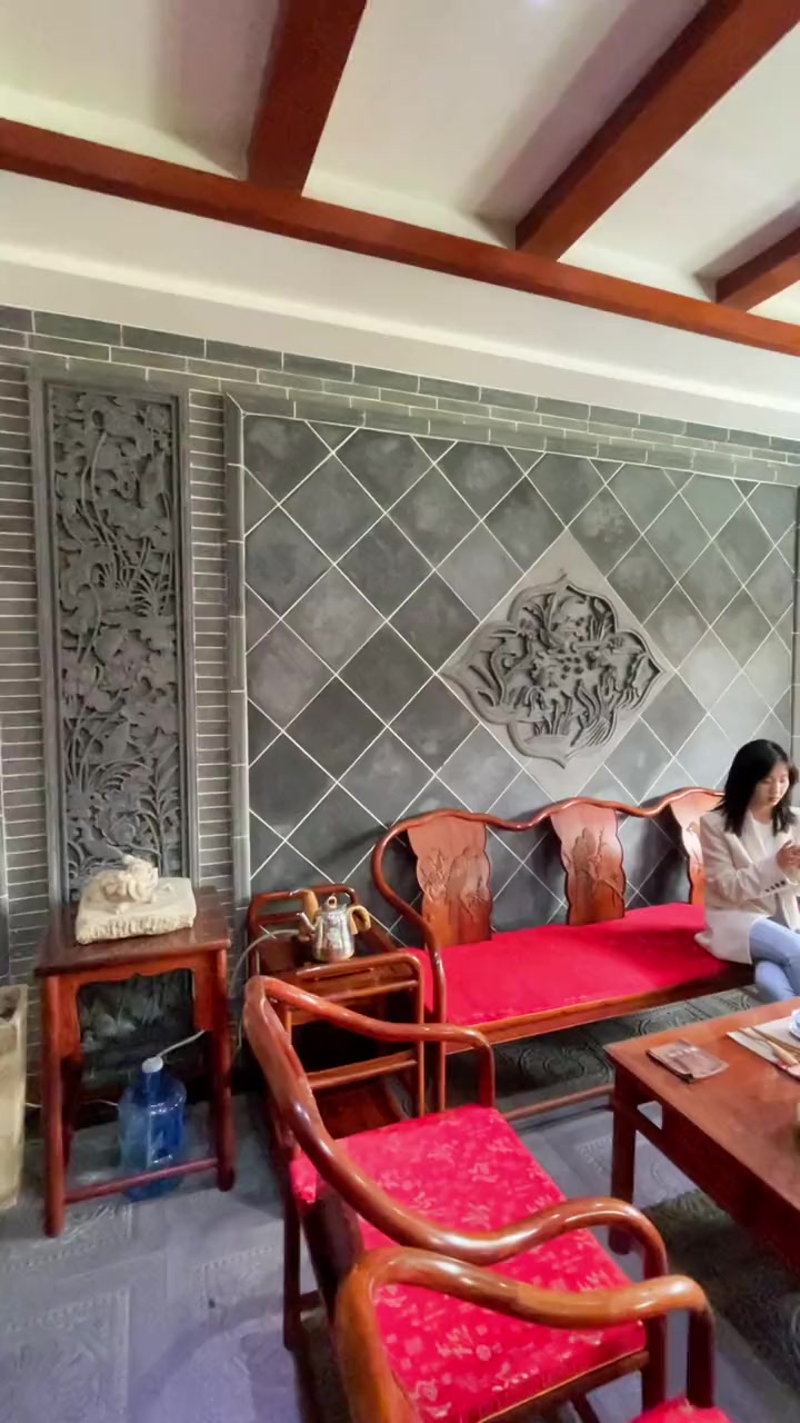 中式风格茶室装修砖雕背景墙更是锦上添花